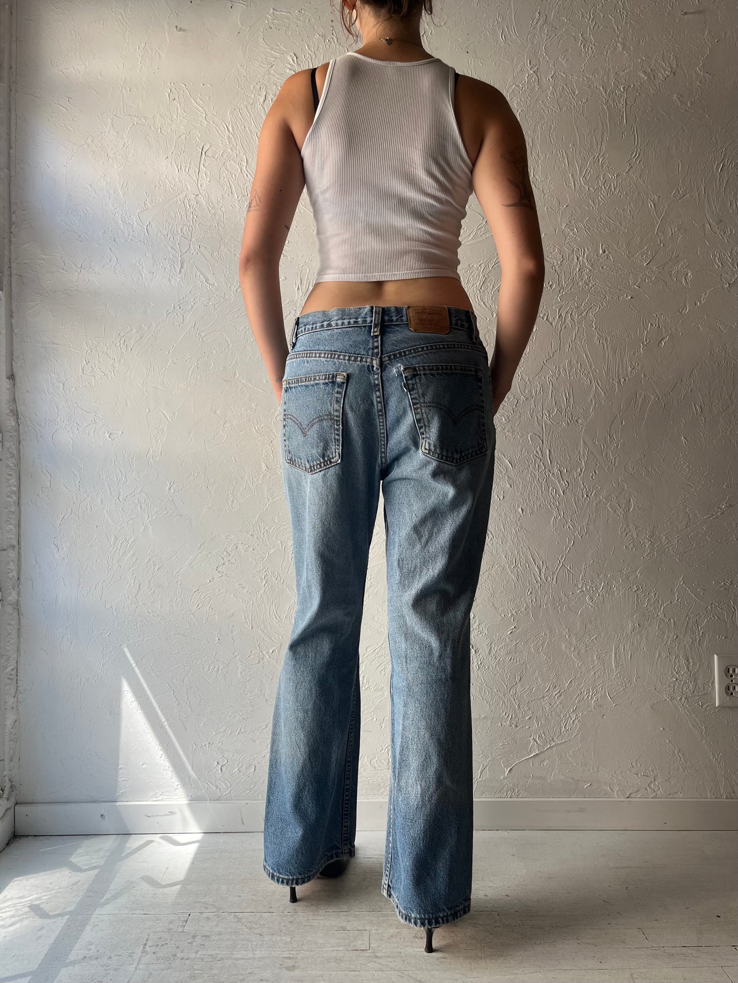 90s 'Levis' Light Wash Denim Mid Rise Jeans / Medium
